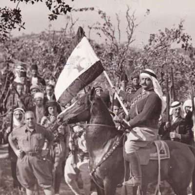 mir majid with lebanese flag on horse
